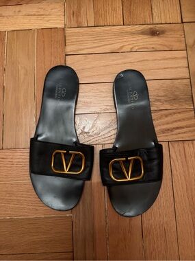 Valentino Garavani Black Leather Slides with Gold V Buckle